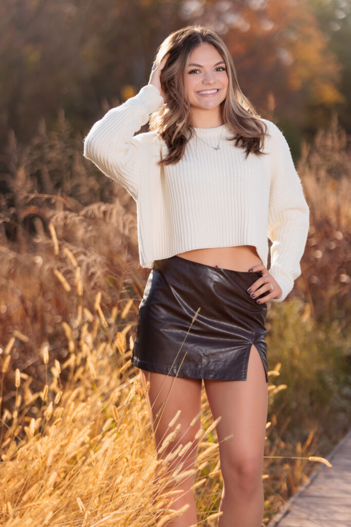 Fall Senior Portraits in tall grass in Raleigh NC