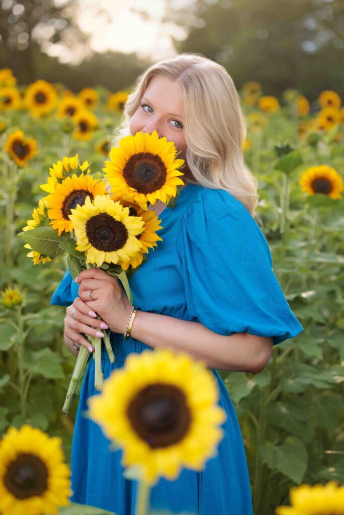 Raleigh Senior Photographer in a sunflower field